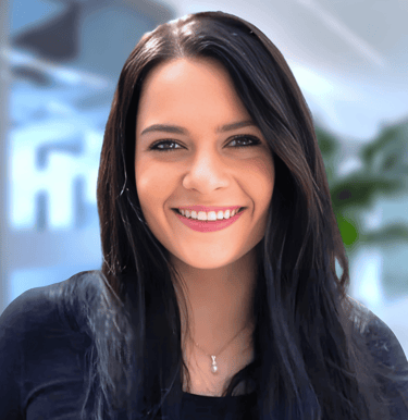 a woman with long hair and a black top
