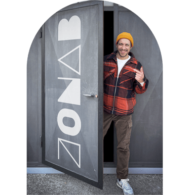 a man standing in front of a door with a door open