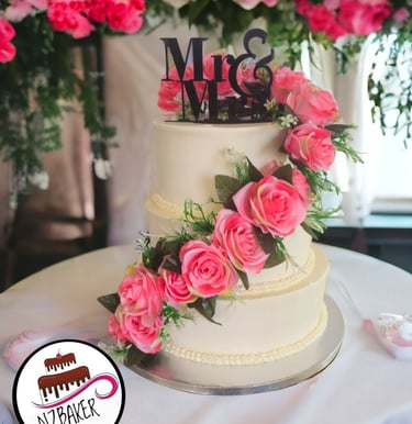 two tier celebration cake with pink flowers by NZBaker Hamilton