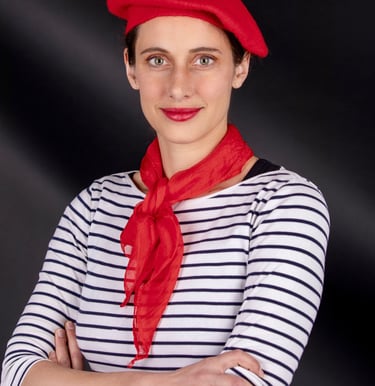 a beautiful French woman teacher in a French costume poses for a picture she is the best tutor