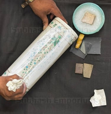 Polishing of a marble article on a black background