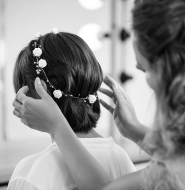 Hair model in bridal updo with veil.