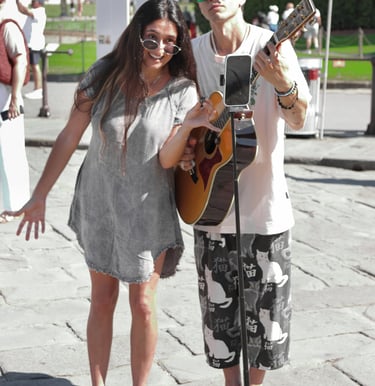 a man and woman standing in front of a microphone and microphone