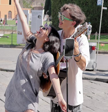 a man and woman standing in front of a parking meter