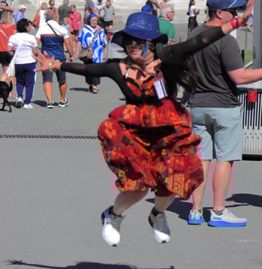 a woman in a red dress and a man in a blue hat