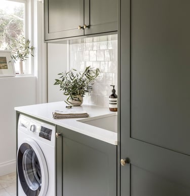 Custom built laundry cabinets by Silva Cabinetry
