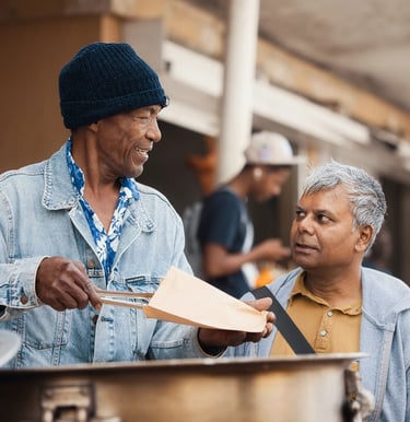 Street vendor in Rodrigues serving food to a customer