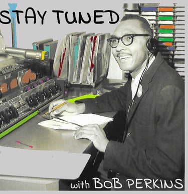Jazz host Bob Perkins sitting at a radio console; image for the podcast Stay Tuned with Bob Perkins