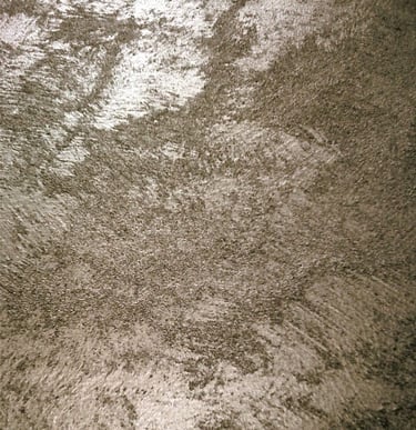 A warm silver paint sample showing its lustre and beautiful grainy texture.