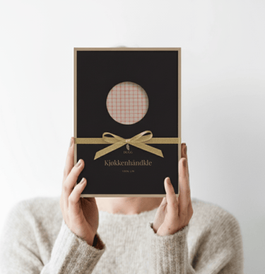 a woman holding a box of duggcandles product