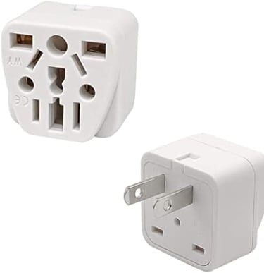 a white and black power plugged in a white wall