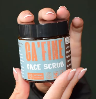 hands holding a cafine skincare product