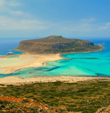 a beach with a boat in the water