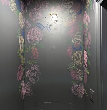 When sketching in a mural, try using colored chalk. It stands out and you can paint right over it with no issues.