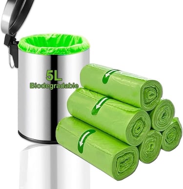 a trash canister with a green trash canister
