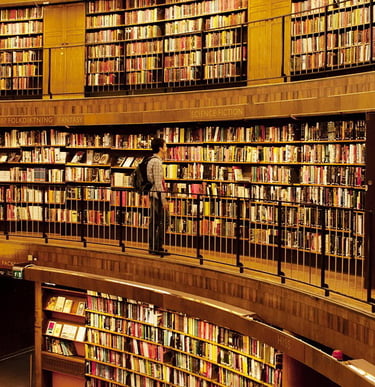student staring the books in a university library