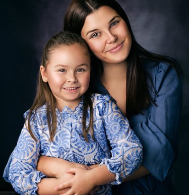 Mother and daughter embracing during a portrait session