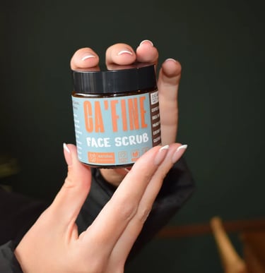 hands holding a cafine skincare product