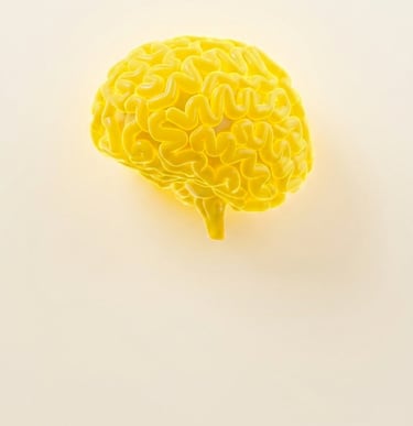 A vibrant 3D yellow human brain model illustrating cognitive function and mental health concepts.