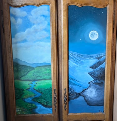 Hand-painted wooden armoire doors featuring a sunny landscape and a moonlit winter scene.