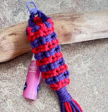handmade macrame chapstick holder in bright red and purple colours