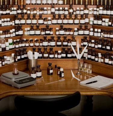 a desk with a lot of bottles of essential oils