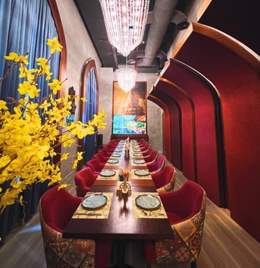 a long table with a vase of flowers and a vase of flowers