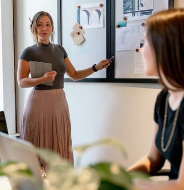 woman presenting on a meeting.Market Positioning for Tourism with Timea Pokol Consultant