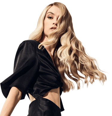 Woman with smooth, shiny hair after keratin treatment.