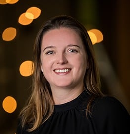 a woman in a black top and a white shirt