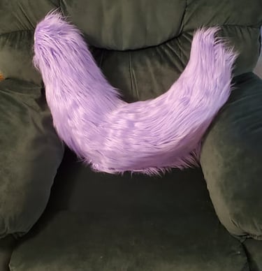 A fluffy purple tail made by Teto Creations