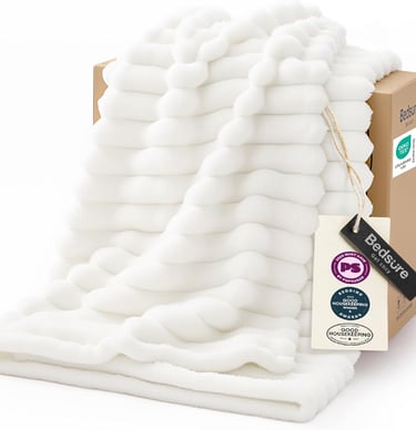 White textured faux fur throw blanket by Bedsure draped over a cardboard gift box packaging.