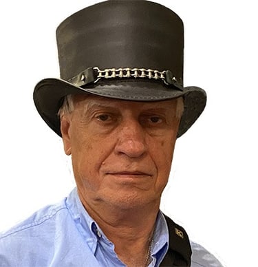 Photo of author Dan Dooley wearing a Steampunk style top hat.
