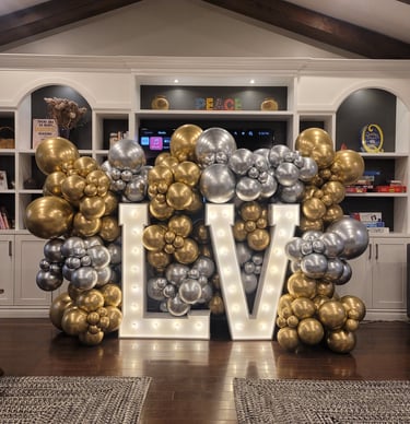 Gold & silver balloons paired with a marquee sign
