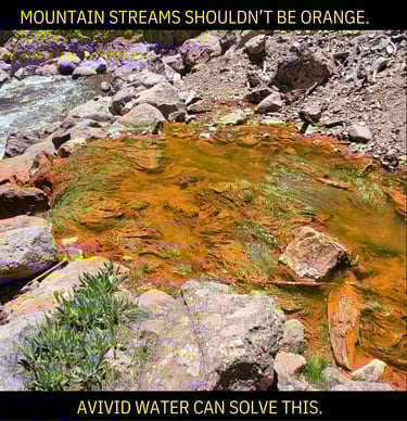 Polluted orange mountain water stream.