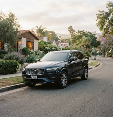 A clean, modern family SUV parked on a quiet residential street in Los Angeles, soft morning daylight, warm editorial photography, 35mm