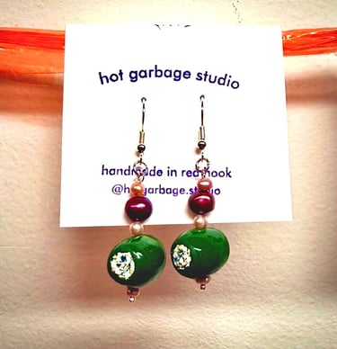 Gold hook dangle earrings with polymer clay blue cheese-stuffed olives and purple pearl beads