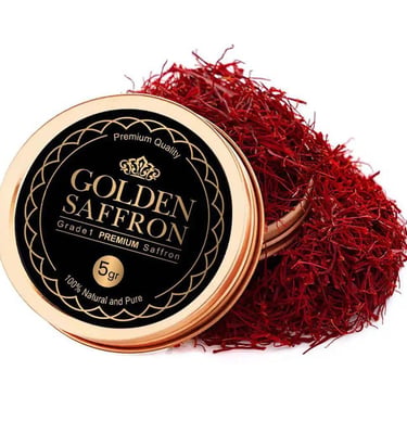 Grade 1 premium Golden Saffron threads spilling out of a 5 gram gold tin on a white background.