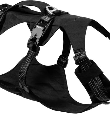 Durable black tactical dog harness with adjustable straps and heavy-duty buckles for outdoor hiking.