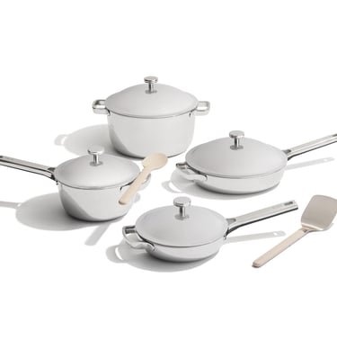 A 10-piece titanium cookware set including pots, pans, and wooden utensils on a white background.