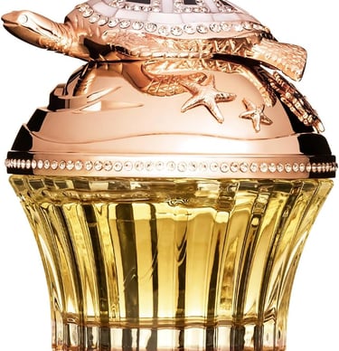 Luxury perfume bottle with a rose gold turtle cap and crystal embellishments.