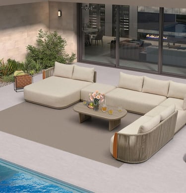 Luxury modern patio furniture set with a beige sectional sofa and coffee table next to a backyard pool.