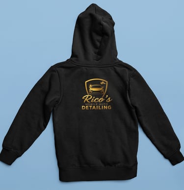 a black hoodie with a gold logo on it
