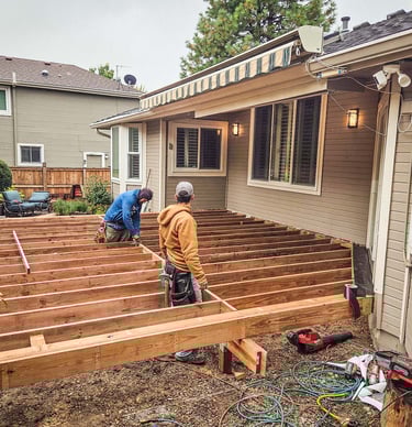 Custom deck framing project behind a home in Lakewood CO