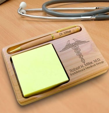 Personalized wooden desk organizer with engraved medical caduceus, name, and pen holder for doctors.