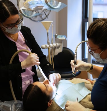 Dentist and dental assistant performing a dental procedure in Times Square, New York