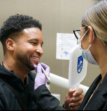 Dentist reviewing dental results with Invisalign during a consultation in Rego Park,  New York