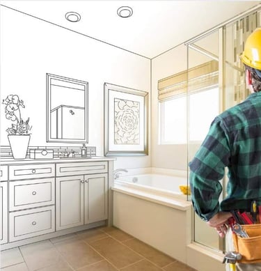 Construction worker wearing a hard hat reviewing a bathroom remodel design.