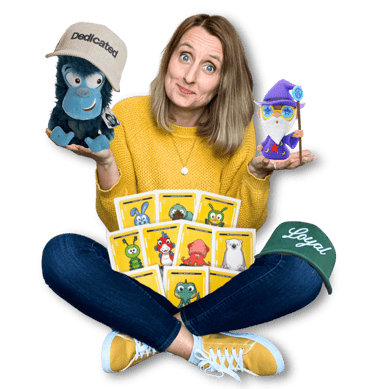 Anne Bagg holding physical Veefriends collectibles like friendscaps, plushies, trading cards, figure