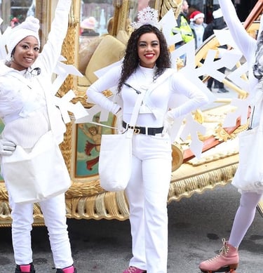 Snowflake skaters posing during a parade